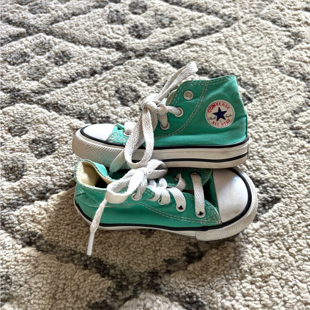 Teal converse high tops